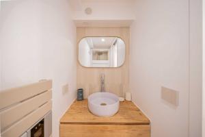 a bathroom with a bowl sink on a wooden counter at Studio in a residence with pool - Saint-Tropez in Saint-Tropez
