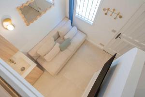 an overhead view of a living room with a couch at Studio in a residence with pool - Saint-Tropez in Saint-Tropez +1 photo