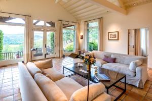 a living room with a couch and a table at Morlet Hilltop House in St. Helena