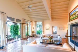 a living room with a couch and a table at Morlet Hilltop House in St. Helena