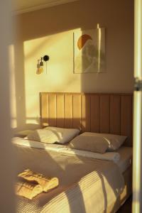 a bedroom with a bed with a basketball picture on the wall at Sunrise Yablunytsia in Yablunytsya