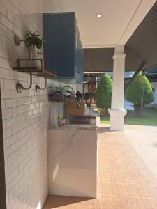 a kitchen with a sink and a counter at Villa La Origin Life in Phuket