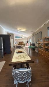 a large kitchen with a table and chairs in it at Brezza sul Colle in Montesilvano