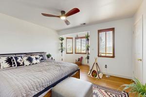 a bedroom with a bed and a ceiling fan at Boat, Hike, Fish! Summer Cabin Near Lake Arrowhead in Running Springs