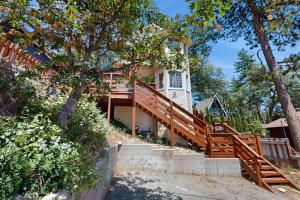 a house with a staircase leading up to it at Boat, Hike, Fish! Summer Cabin Near Lake Arrowhead in Running Springs