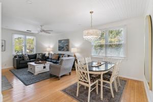 a living room with a table and a couch at Beachcomber, Unit 302 in Demere Park