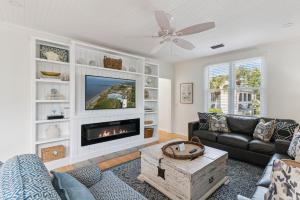 a living room with a couch and a fireplace at Beachcomber, Unit 302 in Demere Park