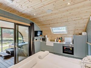 a kitchen in a tiny house with wooden ceilings at 1 Bed in Okehampton oc-92384 in Okehampton