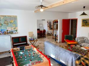 a living room with a pool table at LES PIPISTRELLES 19 - GITE et Chambre d'hôtes in Meymac