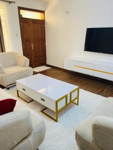 a living room with a couch and a coffee table at Eunas homestay in Eldoret