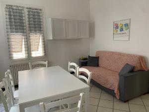 a living room with a couch and a table at Casa Vincenzina in Finale Ligure