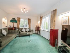 a living room with a couch and a table at The Flat House in Taunton
