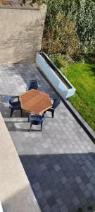 a table and two chairs and a boat on a patio at Wervik-94 in Wervik