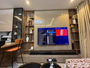 a computer monitor on a wall in a kitchen at Caramel Cove Lekki in Mama