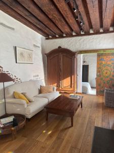 a living room with a couch and a coffee table at Old town gem in Tallinn