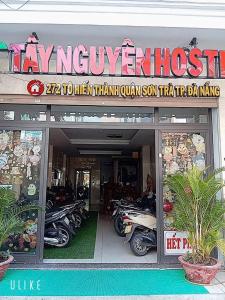 a motorcycle shop with motorcycles parked inside of it at Tây Nguyên hotel Đà Nẵng in Danang