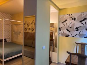 a bedroom with a bunk bed and a mirror at Villa Dorée in Milan