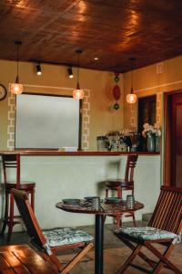 a room with a table and chairs and a whiteboard at Tano Bora Hotel in Sekenani