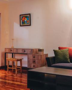 a living room with a couch and a table at Tano Bora Hotel in Sekenani