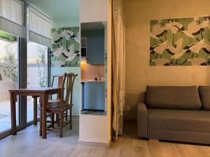 a living room with a couch and a table at Villa Dorée in Milan