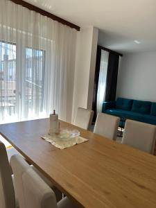 a dining room table with a candle on top of it at Una La Unica in Bihać