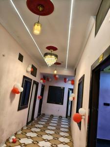 a hallway with orange balls on the walls and a ceiling at The SD hotel and restaurant in Bhopal