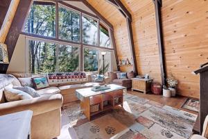a living room with a couch and a table at Chief Peak in Fish Camp