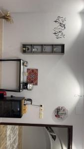 a counter top with a microwave on a wall at لمسة فندقية راقية in Abū Marāgh