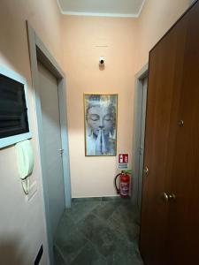 a hallway with a painting on the wall at B&B Da Simone in Battipaglia