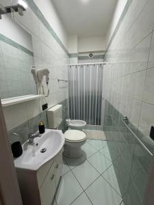 a bathroom with a toilet and a sink and a shower at B&B Da Simone in Battipaglia +13 photos