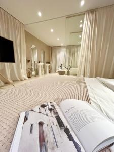 an open book on a bed in a room at KIKO Luxury Lifestyle in Zadar
