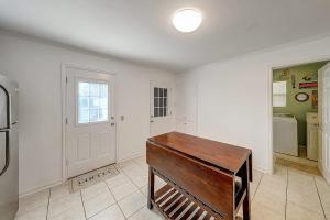 a room with a wooden table in the middle of it at Wharf Cottage in Rockport +28 photos