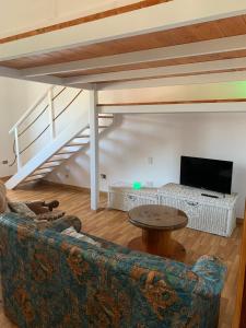 a living room with a couch and a table at Casa vacanze Misilla in Marsala