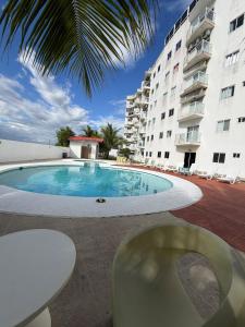 a swimming pool in front of a building at An apartment with ocean views in Chiriquí