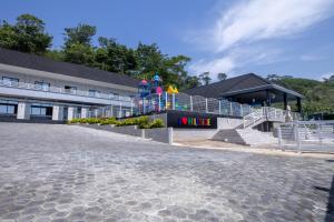 a building with a sign that reads v rise at Hillside hotel in Kenema