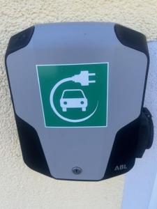 a sign on a wall with a car on it at Landhotel Huberhof Allershausen - Pool is OPEN in Allershausen