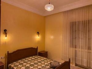 a bedroom with a bed and a window at La Baïa Cozy in Sukrah +7 photos