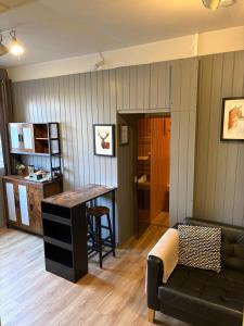 a living room with a couch and a table at Highland Rooms - Room Only No Breakfast in Ullapool +22 photos