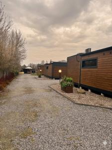 a gravel road with a couple of mobile homes at Domki La Bella 1 in Aleksandria