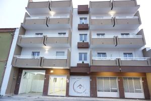 an external view of a building with balconies at Farina Apartments in San Nicola La Strada