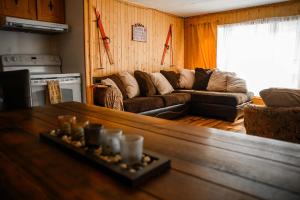 a living room with a couch and a table at Upper Floor - Mont-Video in Barraute +25 photos