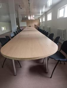 a large conference table in a room with chairs at NR Rest House in Tsaghkadzor