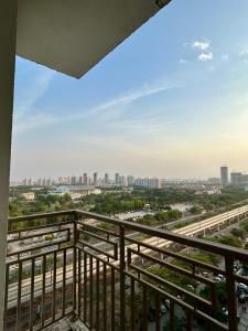 a view of the city from a balcony at Veloria Grand Suites in Greater Noida