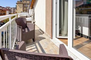 a balcony with two chairs and a window at Cilento Sea Rooms in Agropoli