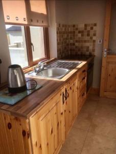 a kitchen with a sink and a counter at Kathleen’s Haven in Causeway