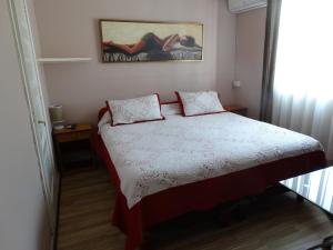 a bedroom with a bed with two pillows on it at hotel rancagua in Rancagua
