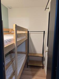 a room with two bunk beds in a room at Studio dans résidence avec piscine in Bidart