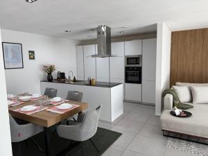 a kitchen and dining room with a table and chairs at JAM Suite in Koblenz +29 photos