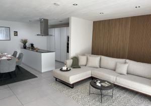 a living room with a couch and a table at JAM Suite in Koblenz