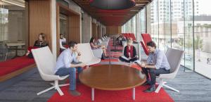 a group of people sitting around a table in an office at Parkside Student Residence Downtown Toronto in Toronto